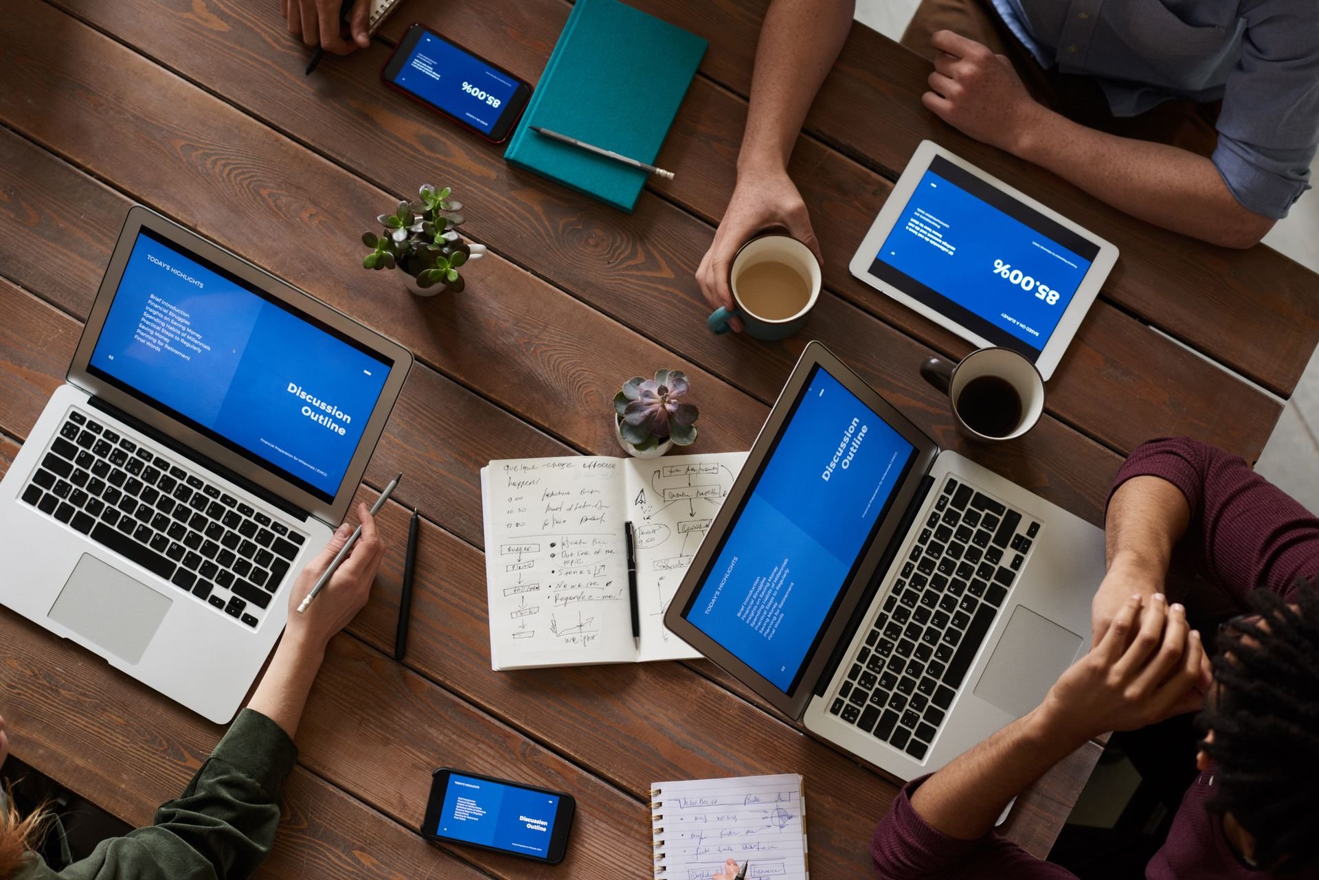 Team in collaboration around a shared workspace